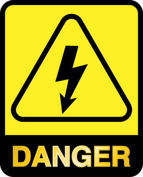 A danger sign with a black arrow and yellow background