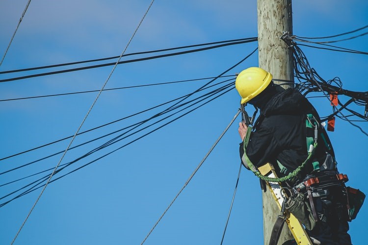 An electrician performing rewiring services in Philadelphia