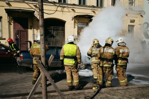 Firefighters extinguishing house fire